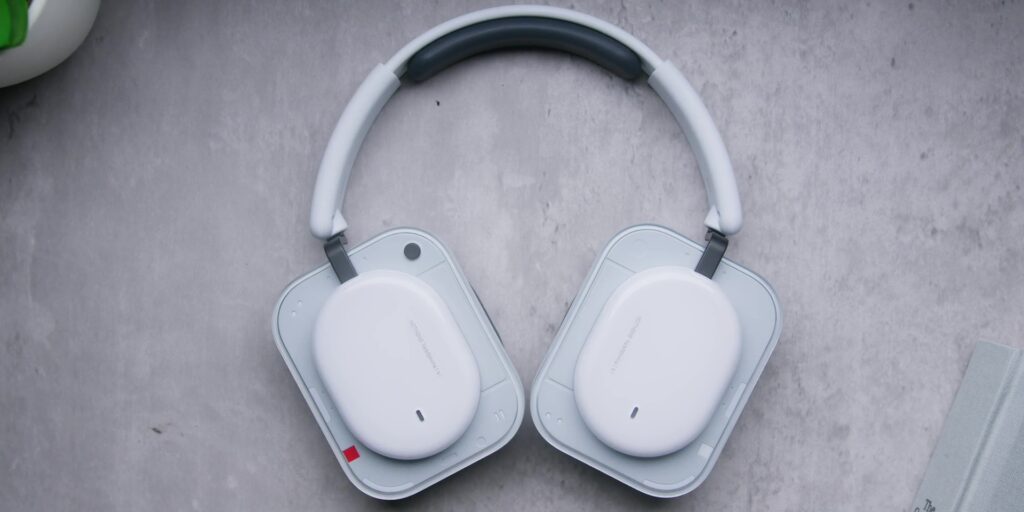 A full perspective view of the Nothing Headphone (a) showing its overall hardware structure and over-ear design.