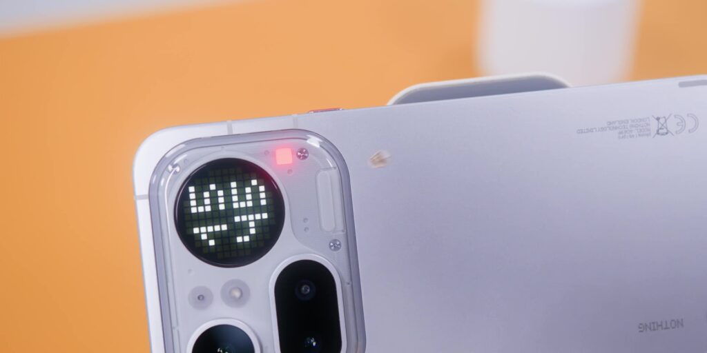 Nothing Phone (4a) Pro: RM300 ($75) More. But Is It Actually Worth It? 5 Close-up of the iconic red LED recording indicator on the back of the device.