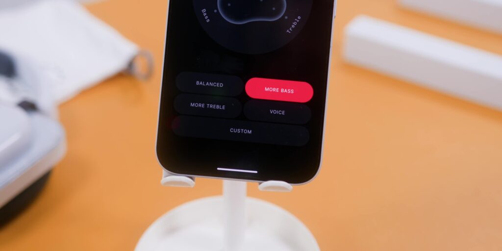 A view of the Nothing X app interface showing the Bass Boost or Equalizer settings being adjusted.