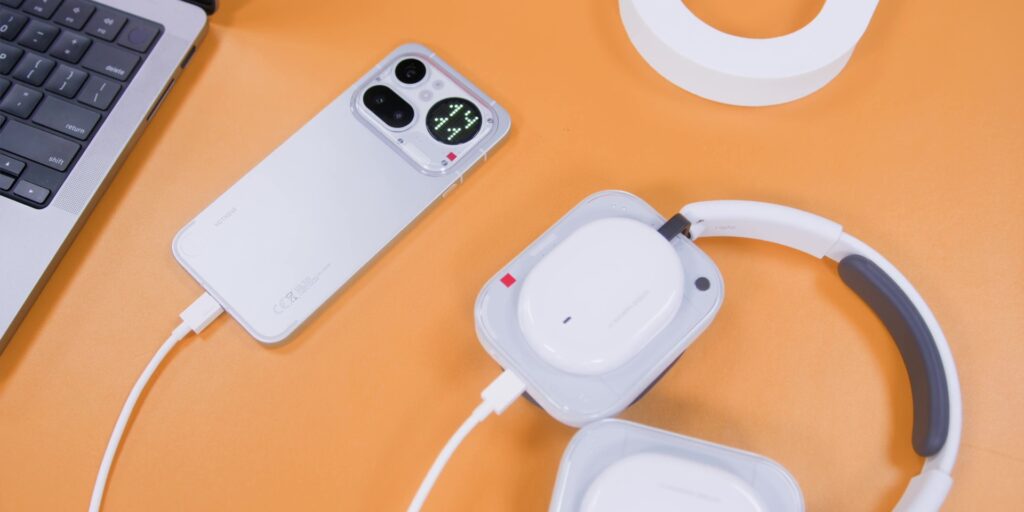 A demonstration of the headphones being charged via a USB-C cable connected to a Nothing phone.
