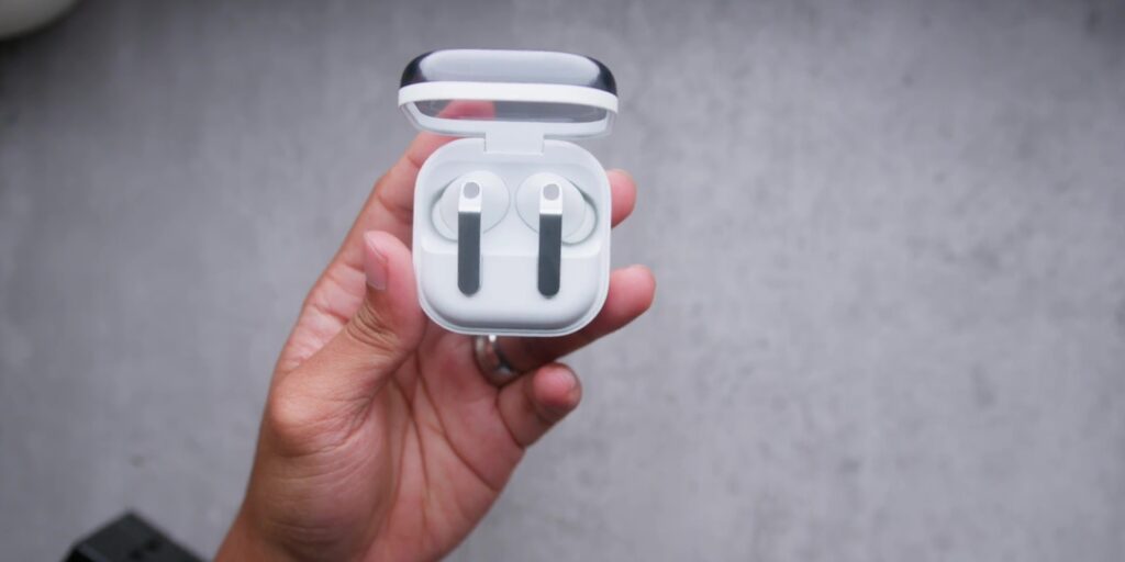Top down view of the Galaxy Buds4 Pro earbuds resting inside their charging case.