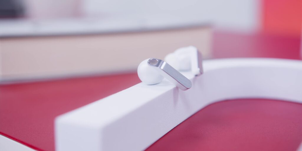 Detail shot of the earbud stem highlighting its unique angular square design.