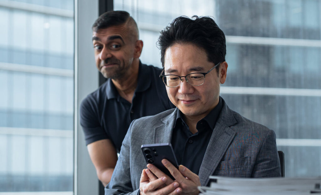 Samsung Malaysia President Charles Kim and Adam Lobo taking a peek