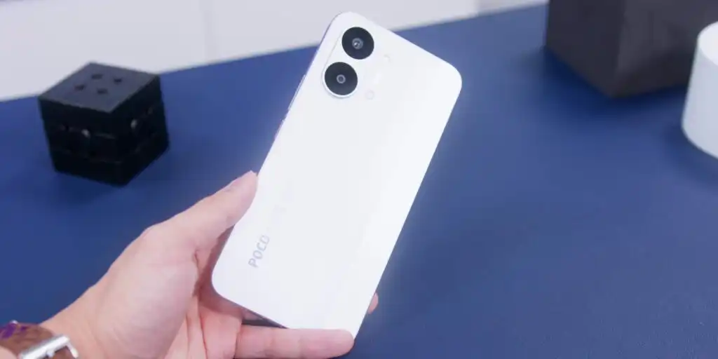 Close up of a person holding the Poco X8 Pro Max smartphone to show its real world size and ergonomics.