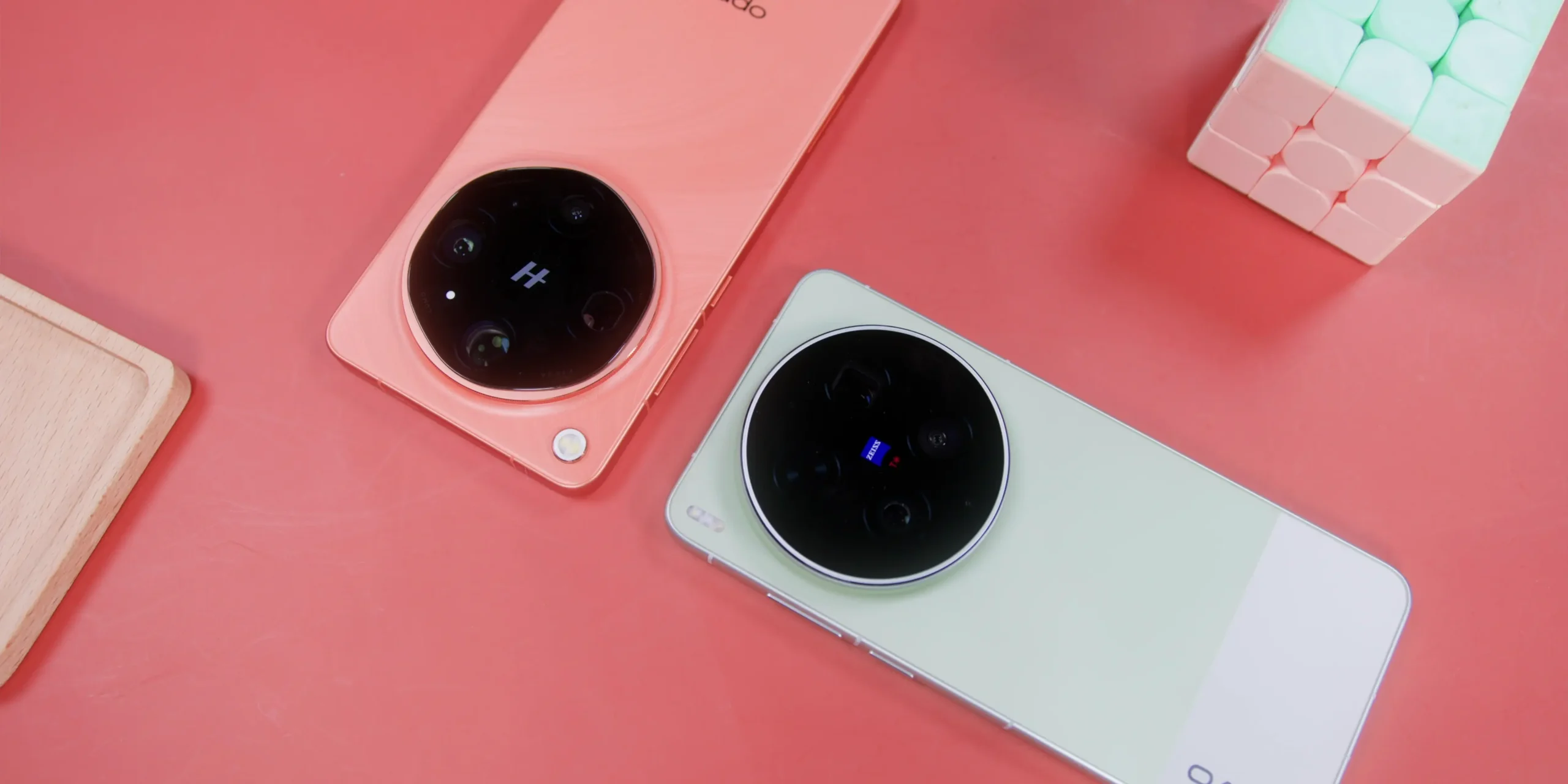 vivo X300 Ultra vs OPPO Find X9 Ultra: Camera Comparison 18 Hero shot comparing the Vivo X300 Ultra and Oppo Find X9 Ultra flagship smartphones side by side, highlighting their premium back panel designs and massive circular camera modules.